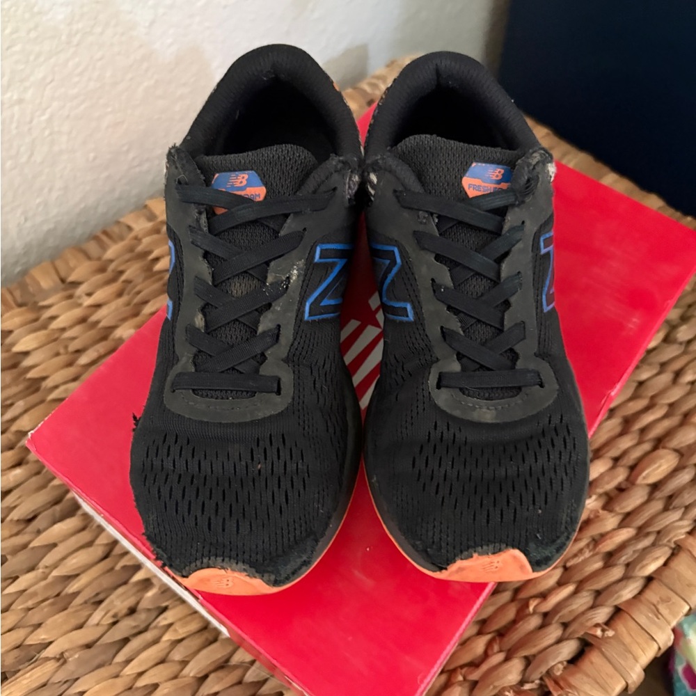 New Balance Black Sneakers with Blue and Orange Accents